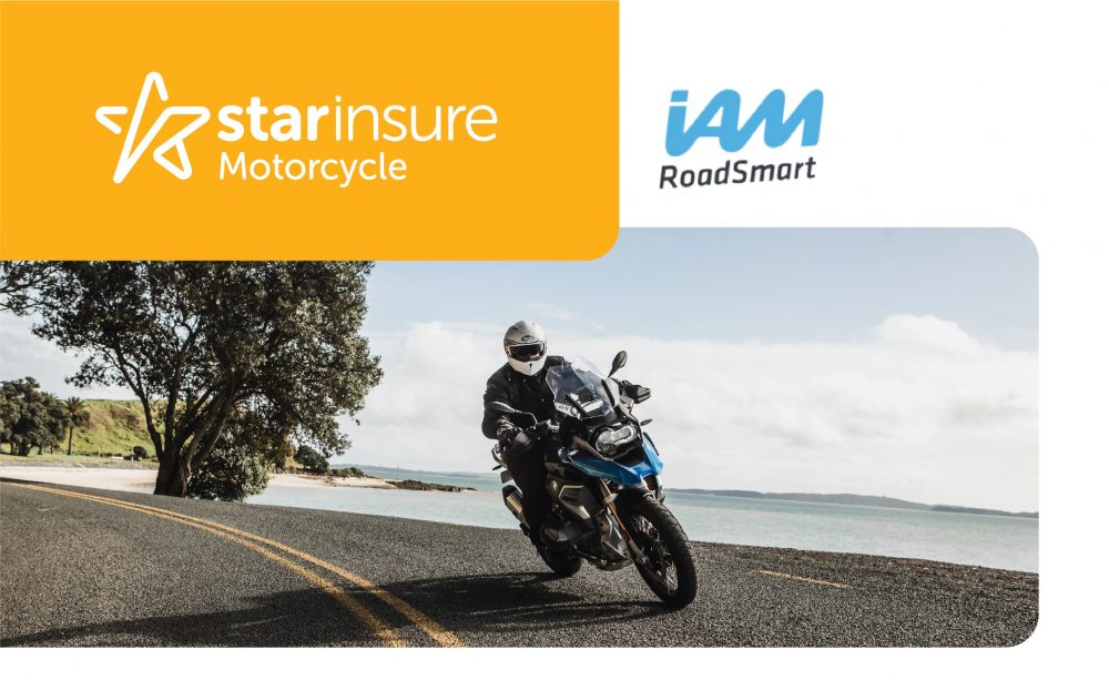 Star Insure Motorcycle with a biker driving down a New Zealand beach road